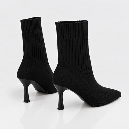 Pair of black sock boots, back view
