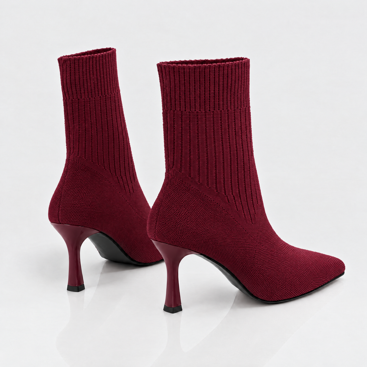 Pair of Red Wine sock boots, back view